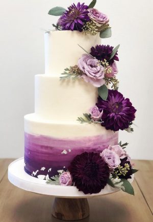 Three tier purple wedding cake