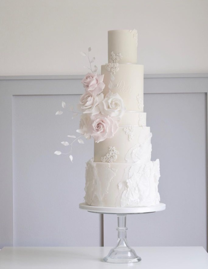 4 tier white and blush cake